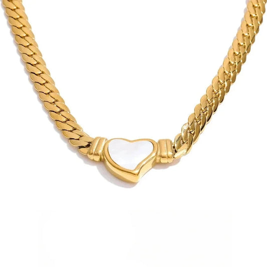 Gold chain necklace with a heart-shaped pendant on a white background