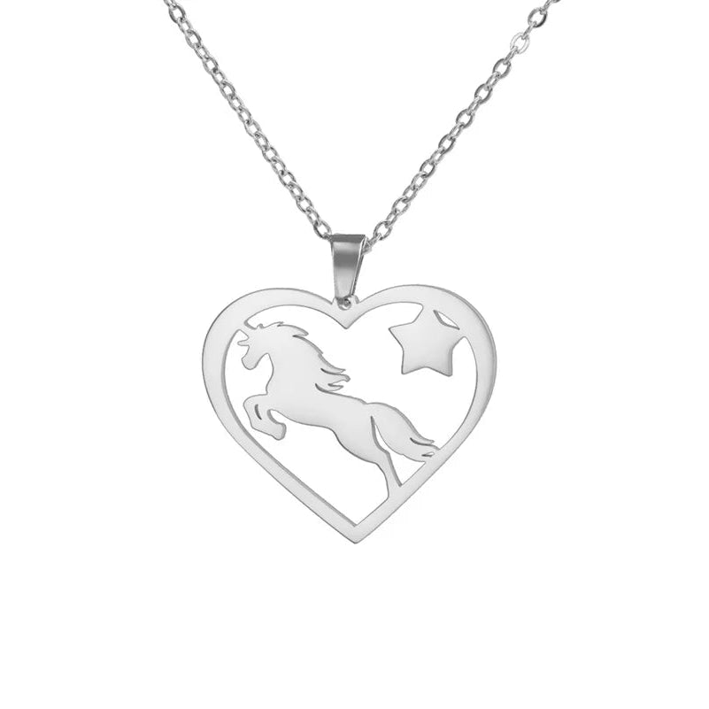 Silver heart-shaped pendant with unicorn design on a white background