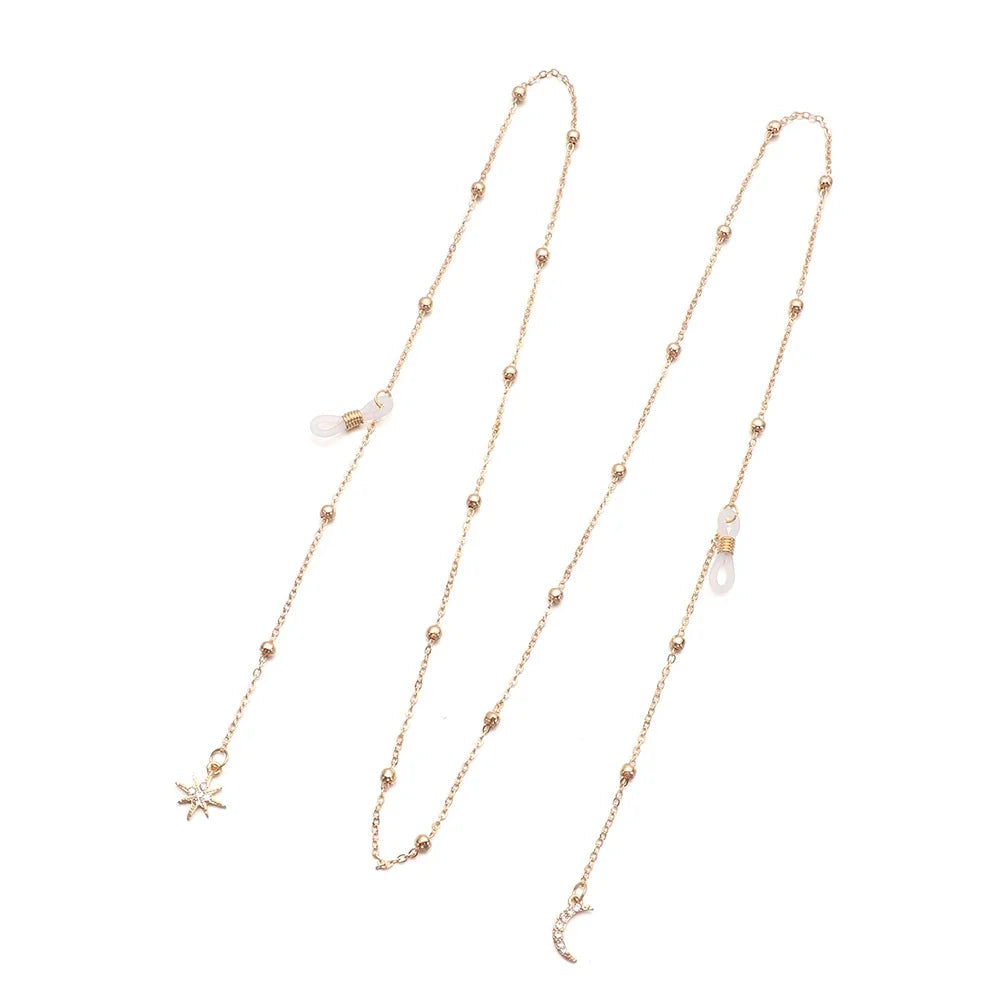 Long gold chain with star and moon pendant.