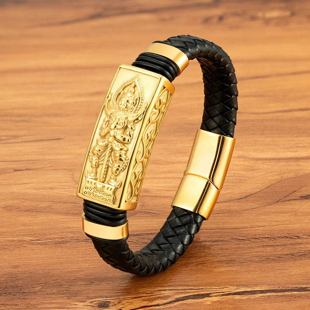 Gold and black bracelet on a wooden surface