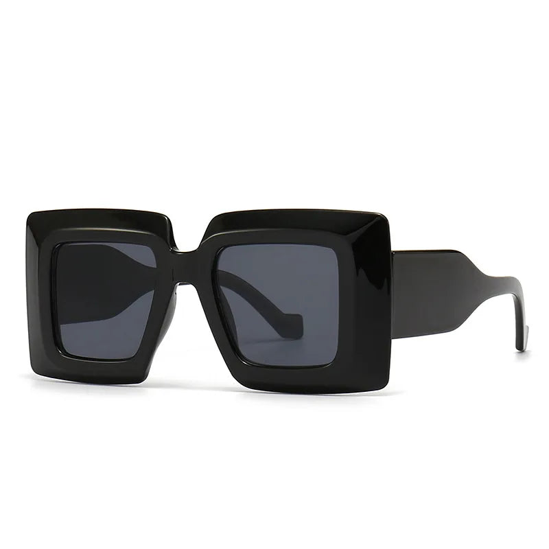 Black sunglasses with a square frame on a white background