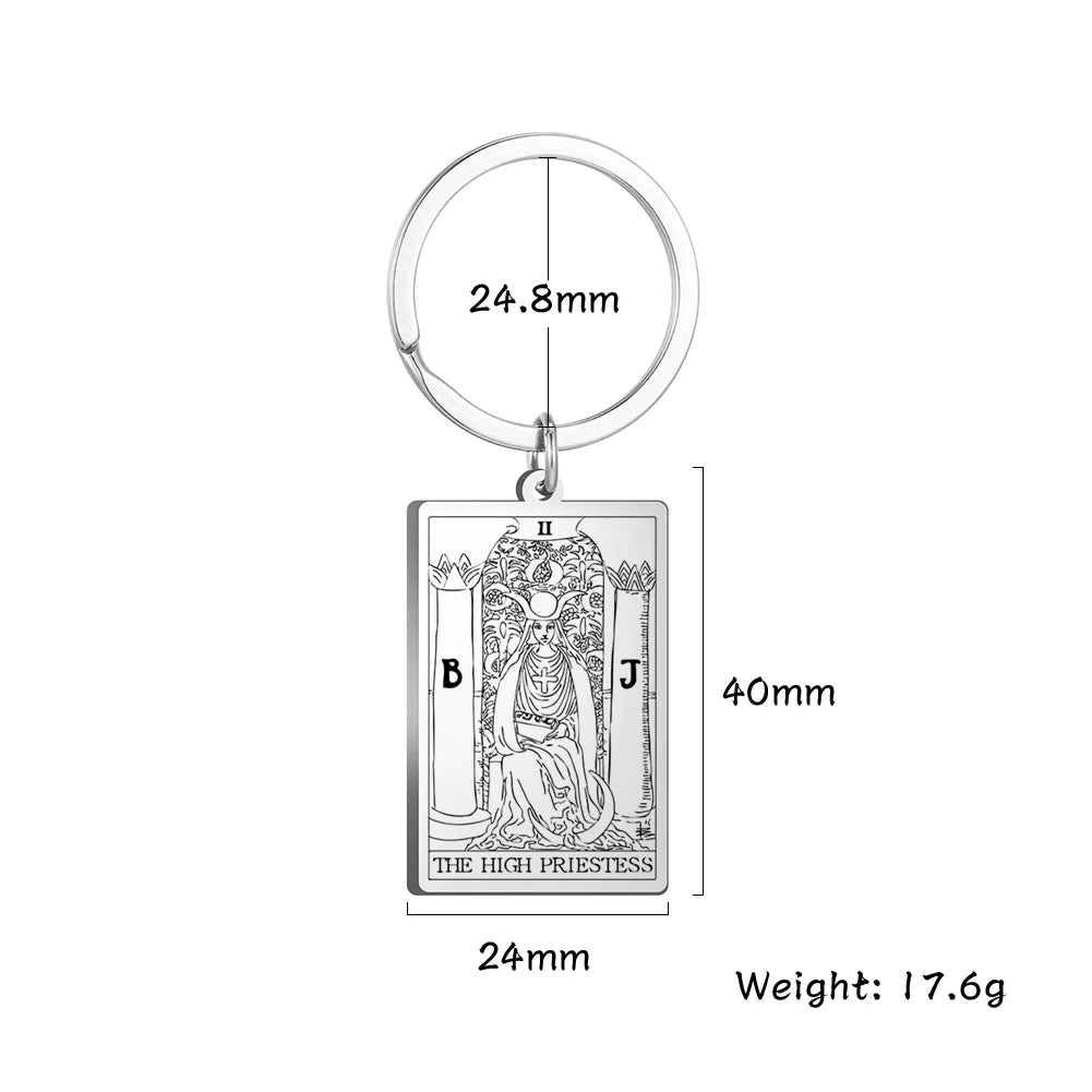 Keychain with tarot card design and measurements on a white background