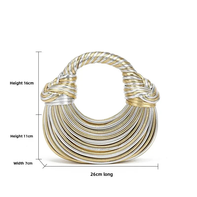 Gold and silver crescent shape handbag with dimensions on a white background