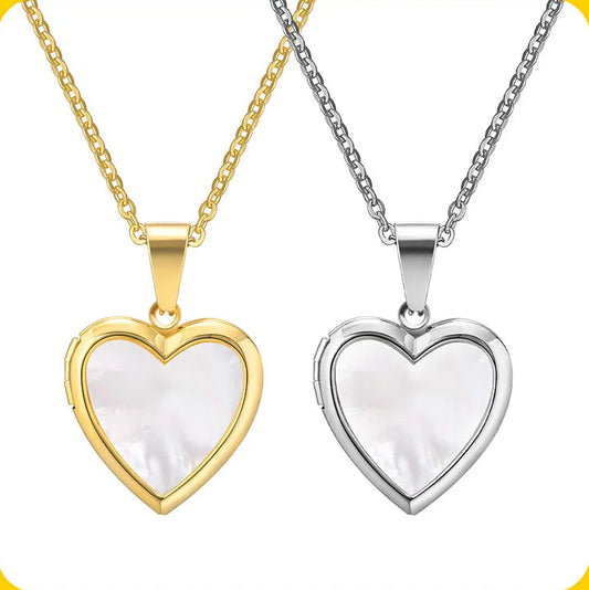 Two heart-shaped locket necklaces on white background.