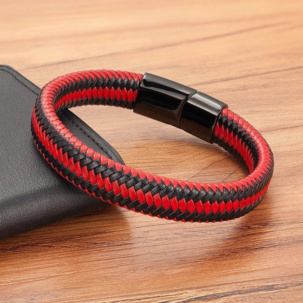 Red and black braided bracelet on a wooden surface