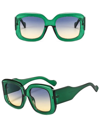 Green sunglasses with gradient lenses on a white background