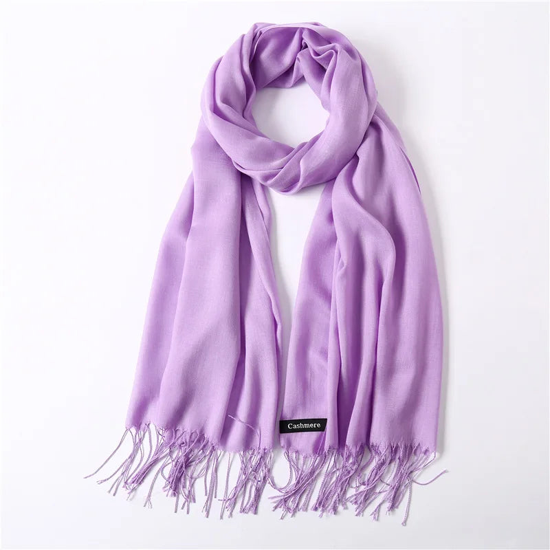 Purple scarf with fringes on a white background