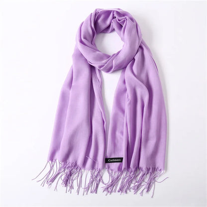 Purple scarf with fringes on a white background