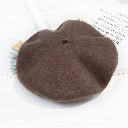 Brown beret on a white surface with a blurred background
