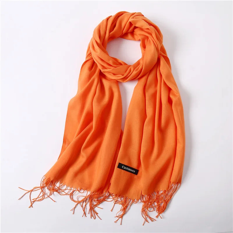 Orange scarf with fringes on a white background