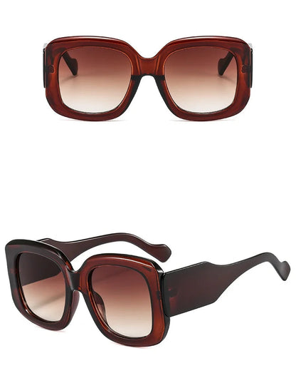 Brown sunglasses with gradient lenses on a white background