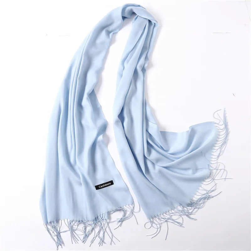 Light blue scarf with tassels on a white background