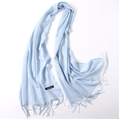 Light blue scarf with tassels on a white background