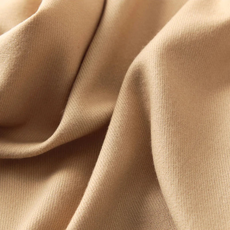Close-up of beige fabric with folds