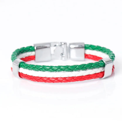 Green, white and red braided bracelet with silver clasp on a white background
