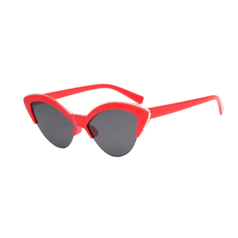 Red cat-eye sunglasses with dark lenses on a white background
