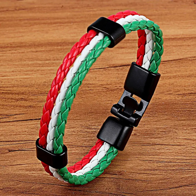 Bracelet with red, white, and green braided pattern on a wooden surface