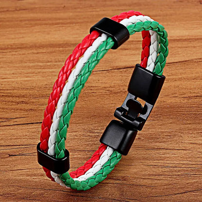 Bracelet with red, white, and green braided pattern on a wooden surface