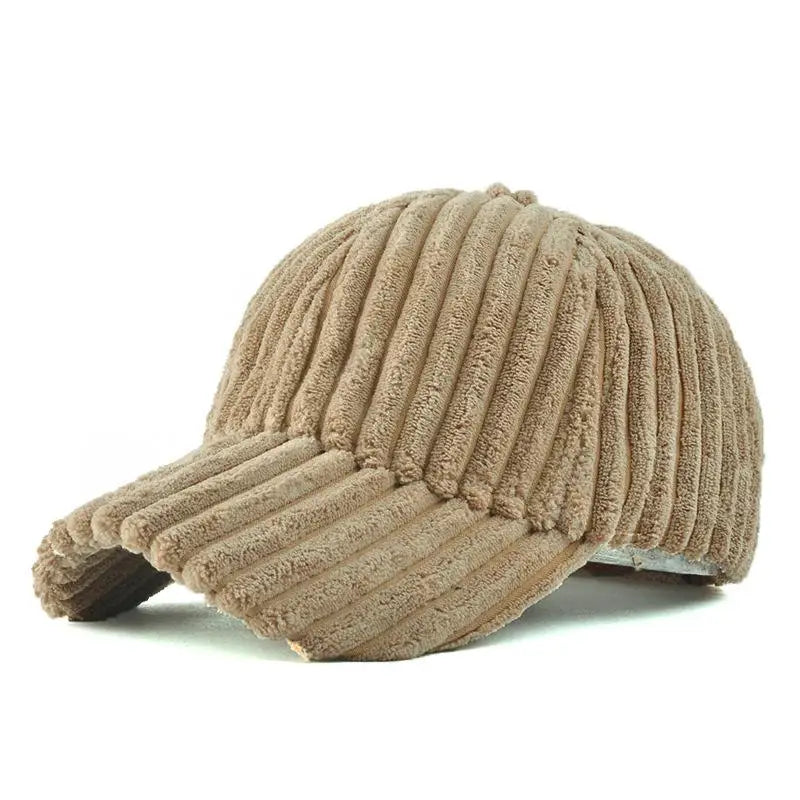 Beige ribbed design corduroy baseball cap on a white background