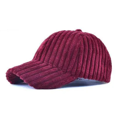 Wine red ribbed corduroy baseball cap on a white background