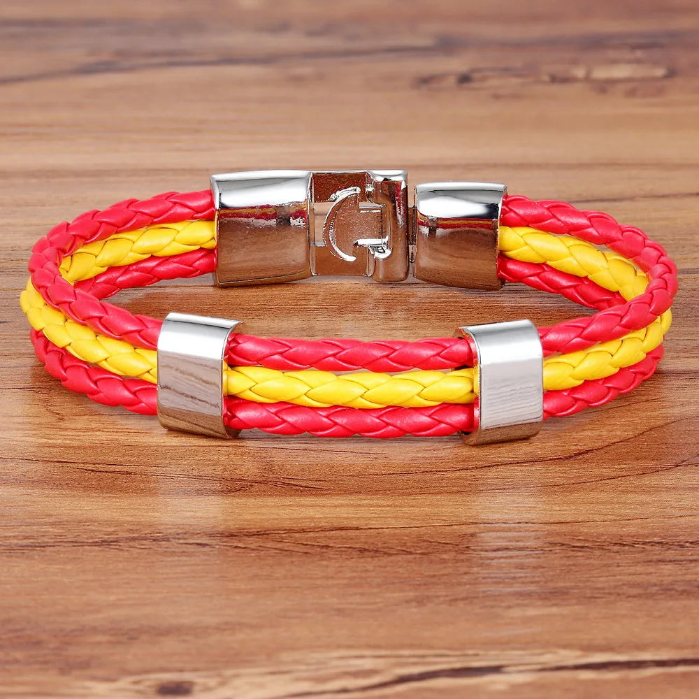 Bracelet with red and yellow braided design on a wooden surface