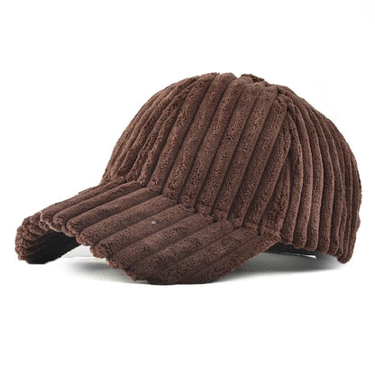 Brown ribbed corduroy baseball cap on a white background