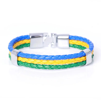 Bracelet with blue, yellow, and green braided design on a white background