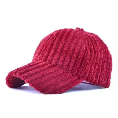 Red ribbed design corduroy baseball cap on a white background