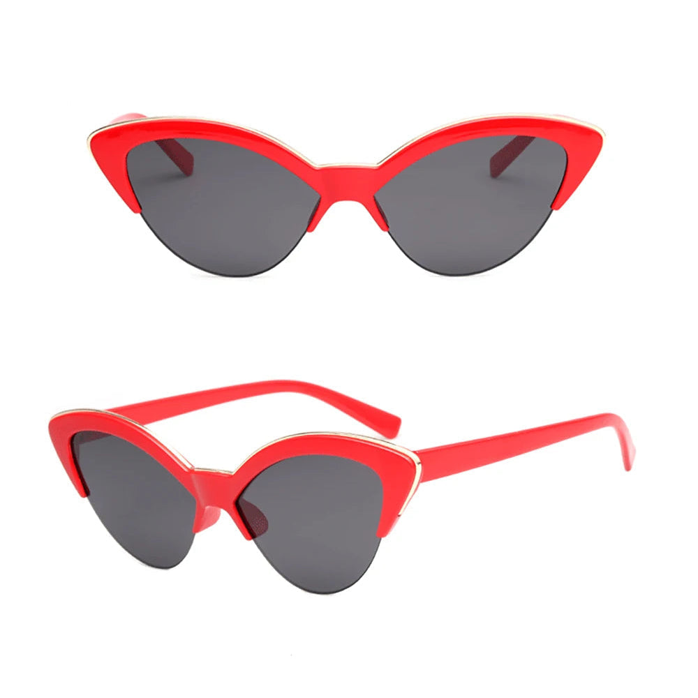 Red cat-eye sunglasses with grey lenses on a white background