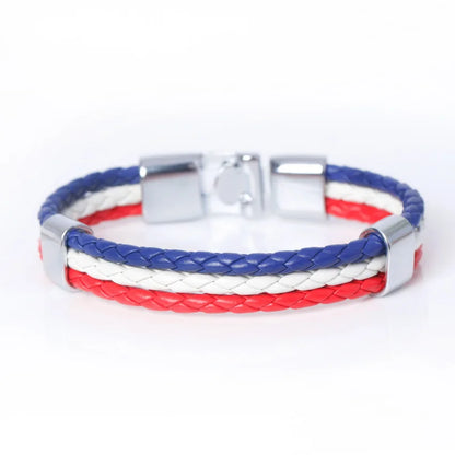 Bracelet with red, white, and blue braided design on a white background