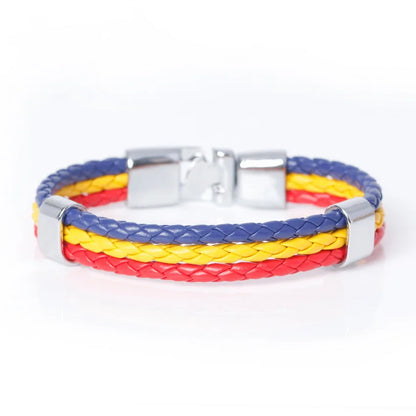 Bracelet with red, yellow, and blue braided design on a white background