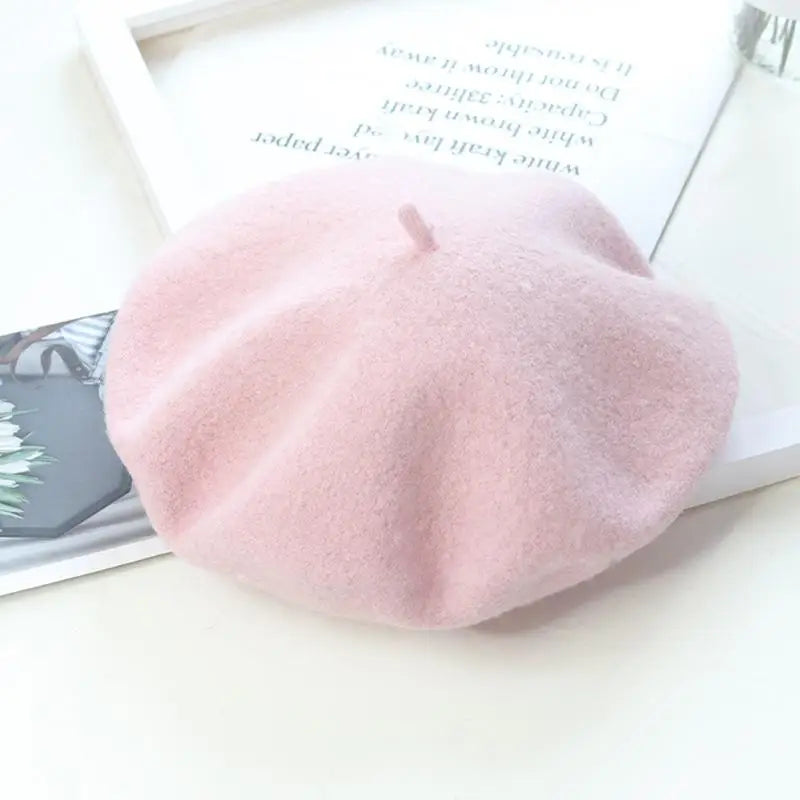 Pink beret on a magazine with text