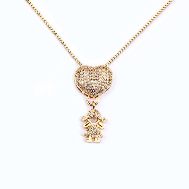 Gold necklace with a heart-shaped pendant and a small charm on a white background