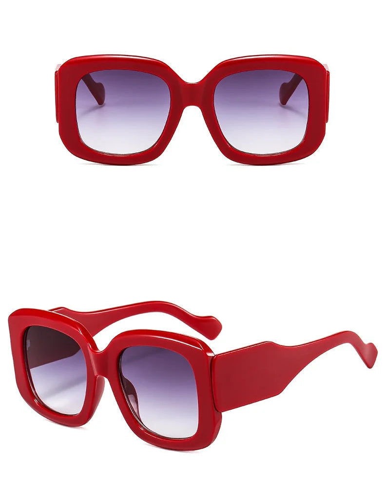 Red sunglasses with a white background