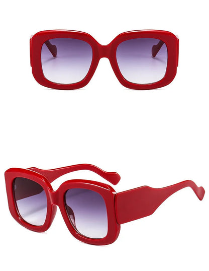Red sunglasses with a white background