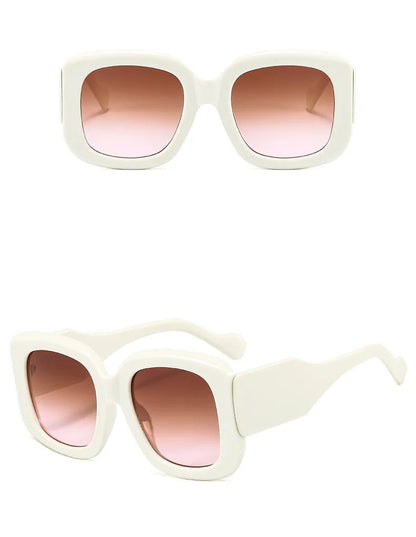 White sunglasses with pink gradient lenses on a white background
