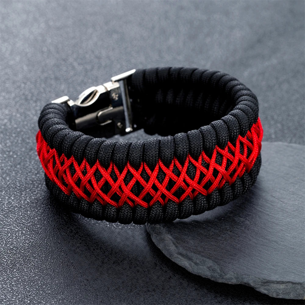 Black and red braided bracelet on a dark surface