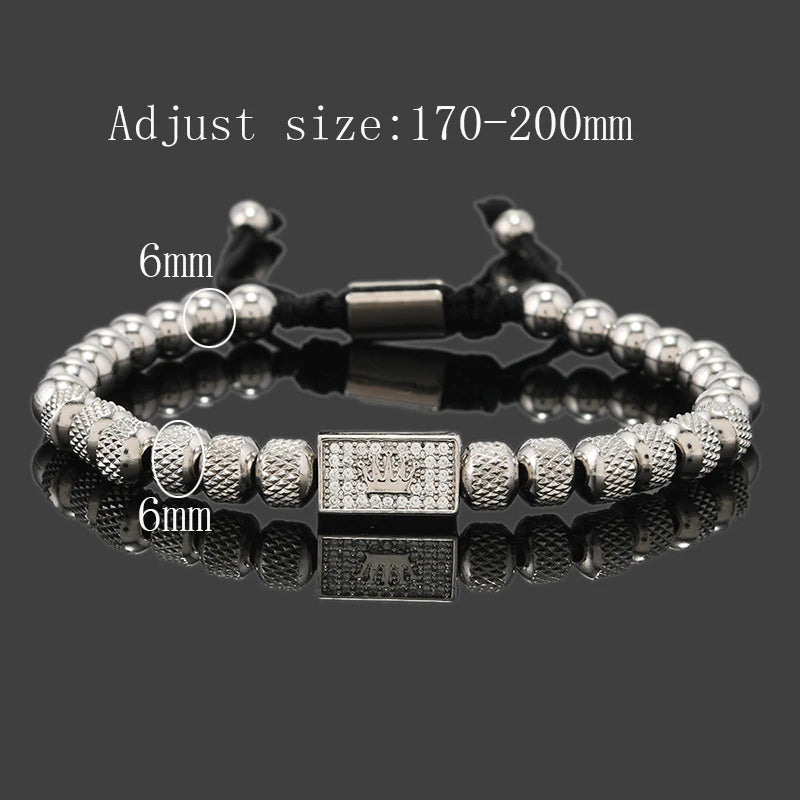 Silver beaded bracelet with a clasp on a reflective surface, size adjustment information above.