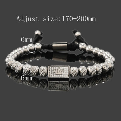 Silver beaded bracelet with a clasp on a reflective surface, size adjustment information above.