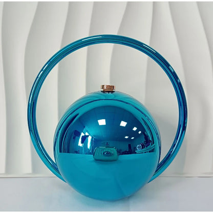 Blue spherical handbag with a handle on a white background