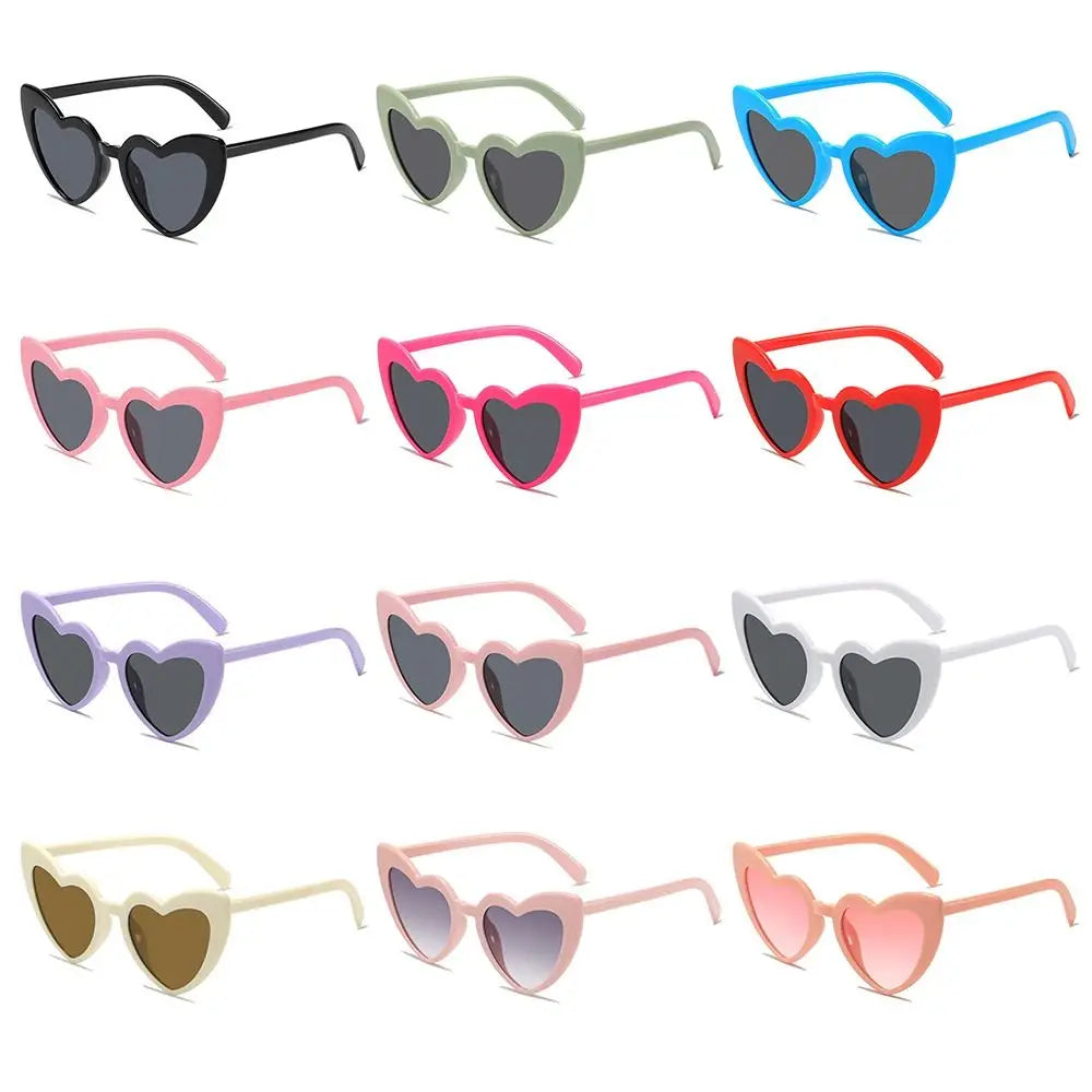 Collection of heart-shaped sunglasses in various colours on a white background