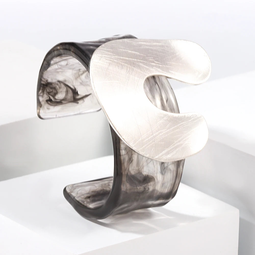 Marble-patterned cuff bracelet on a white background