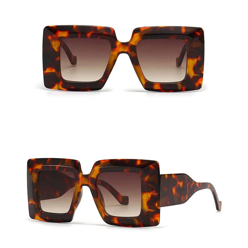 Tortoiseshell sunglasses with gradient lenses on a white background