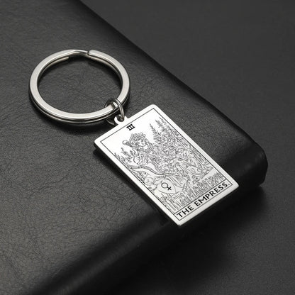 Keychain with 'The Empress' tarot card design on a dark surface