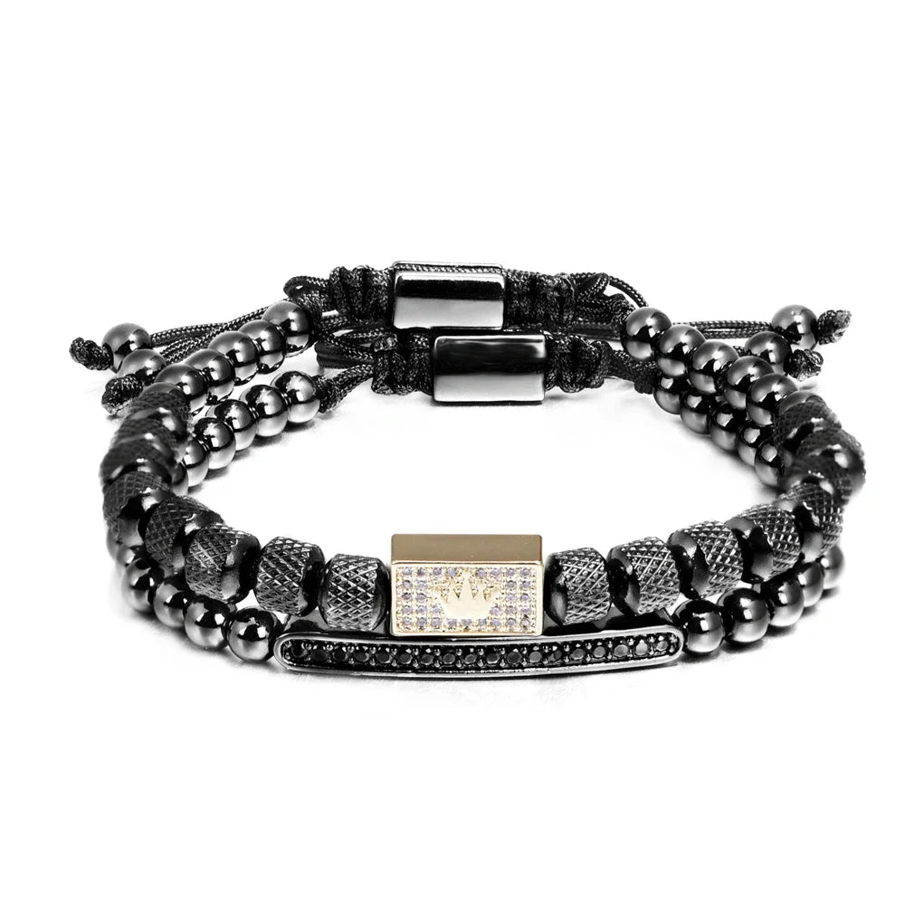 Black beaded bracelet with metal accents on a white background