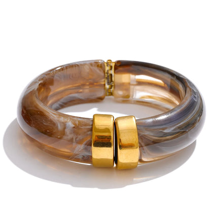 Multicoloured bracelet with gold clasp on a white background