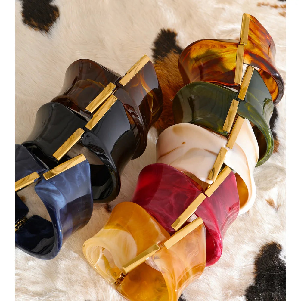 Set of colourful bracelets on a textured surface