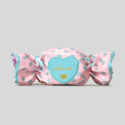Product display of a pink candy shaped bag with a heart label on a grey background