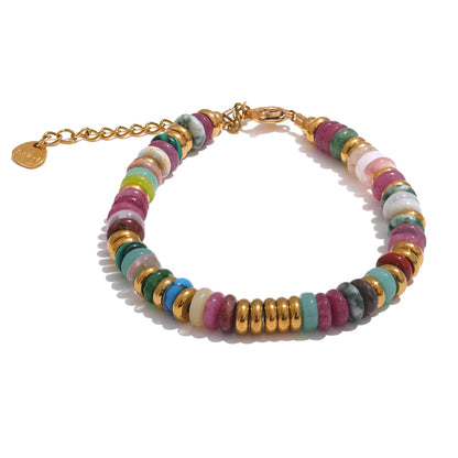 Multicoloured beaded bracelet with gold chain on a white background