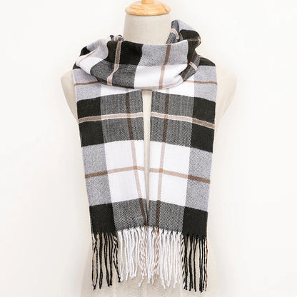 Plaid scarf with black, white, and beige colours on a mannequin against a white background